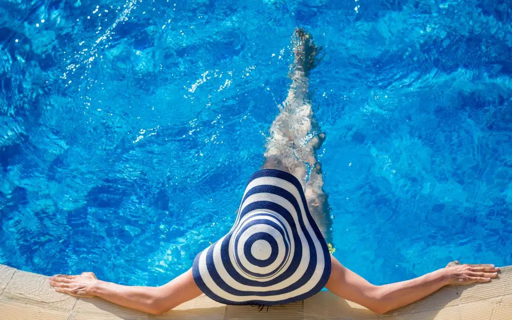 Swimmer doing backstroke in a swimming pool at Crane Aquatics.
